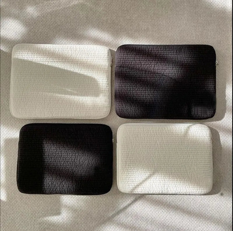 Black and white anti-seismic cotton clutch laptop bag for tablets, showing internal coin pocket.