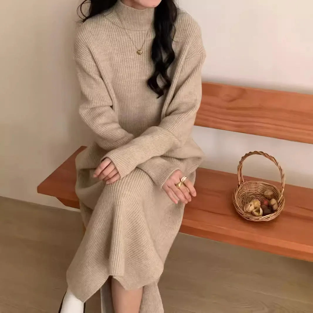 Half turtleneck knitted dress in a solid colour on a model, showing high waist and midi length.