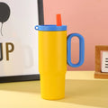 Insulated tumbler cup with a carrying handle and a straw, shown in one of five colour options.