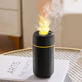 Black car aroma diffuser with flame simulation effect showing automatic sprayer functionality