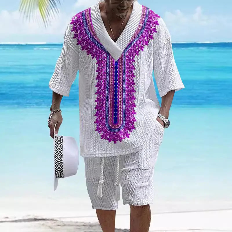 Man wearing a printed drop-shoulder knitted short-sleeve top with matching shorts, a casual loungewear set.