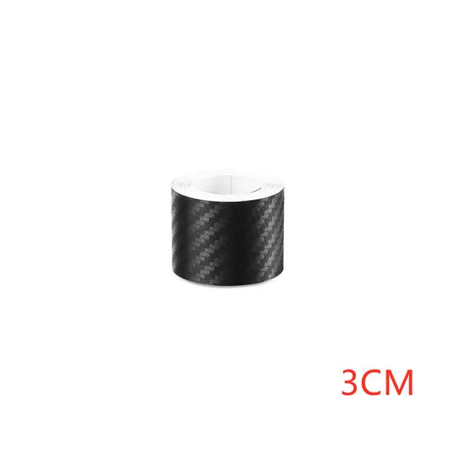 Matte carbon fibre pattern adhesive protection roll for car door sills and bumpers.