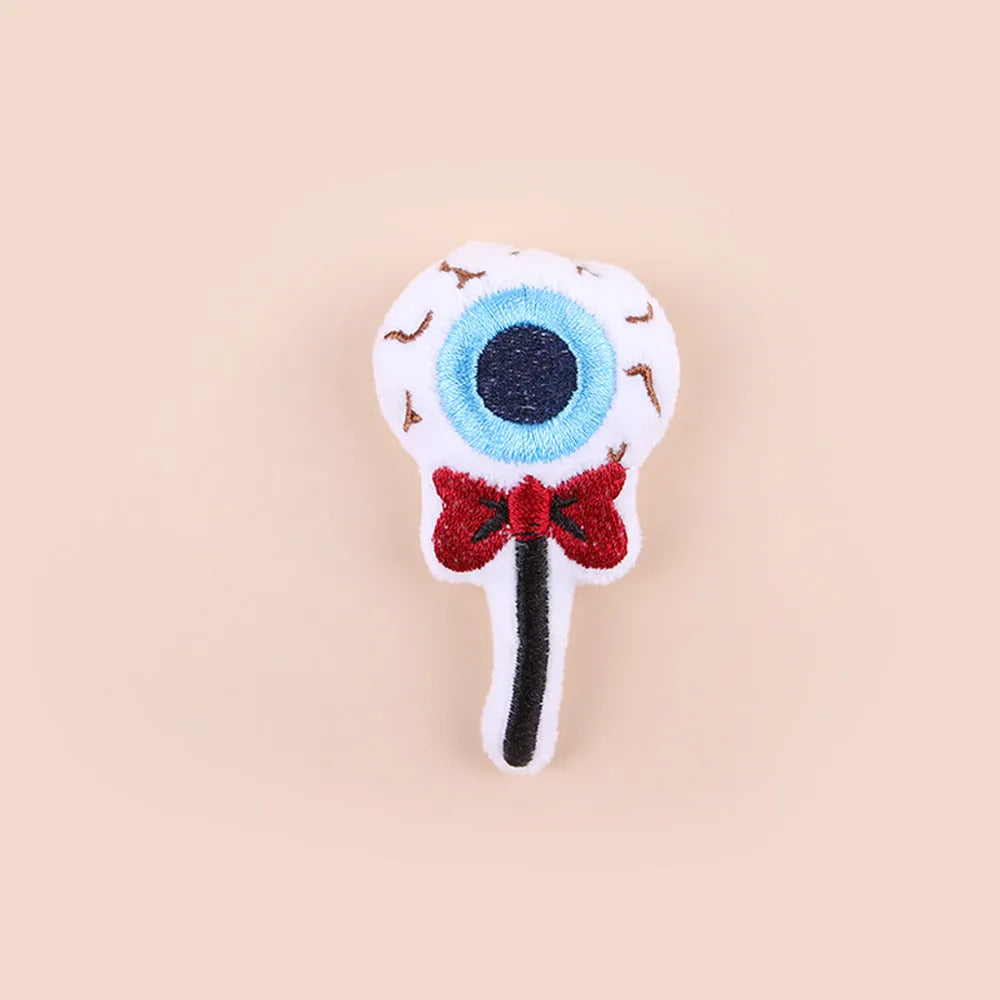 Small plush cat teaser toy with feather wand attachment in candy design