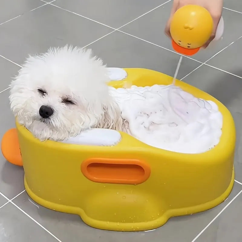 Blue PVC duck-shaped bathtub for washing dogs and cats on a lawn