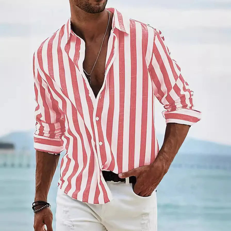 Man wearing a loose-fit, grey and white striped long-sleeved cardigan-style shirt.