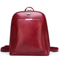 Women's fashion PU backpack in black with shoulder strap and top handle, casual daypack design.