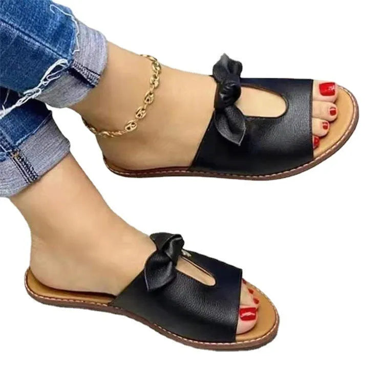 Women's black fish mouth slipper sandals with a decorative bow on the artificial PU upper.