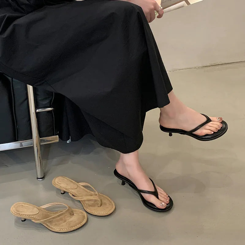 Women's open-toed stiletto sandals with round toe in rubber material, available in sheepskin camel and black