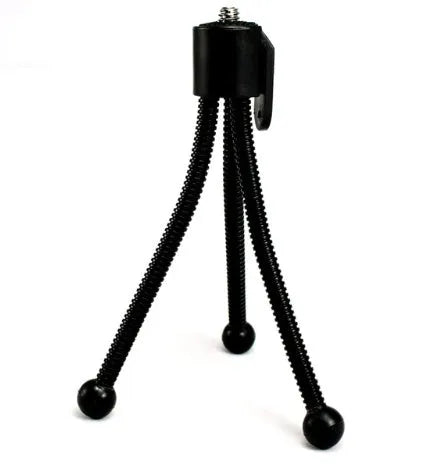 Small black iron frame mini tripod with telescopic legs extended, showing universal ball head mount.
