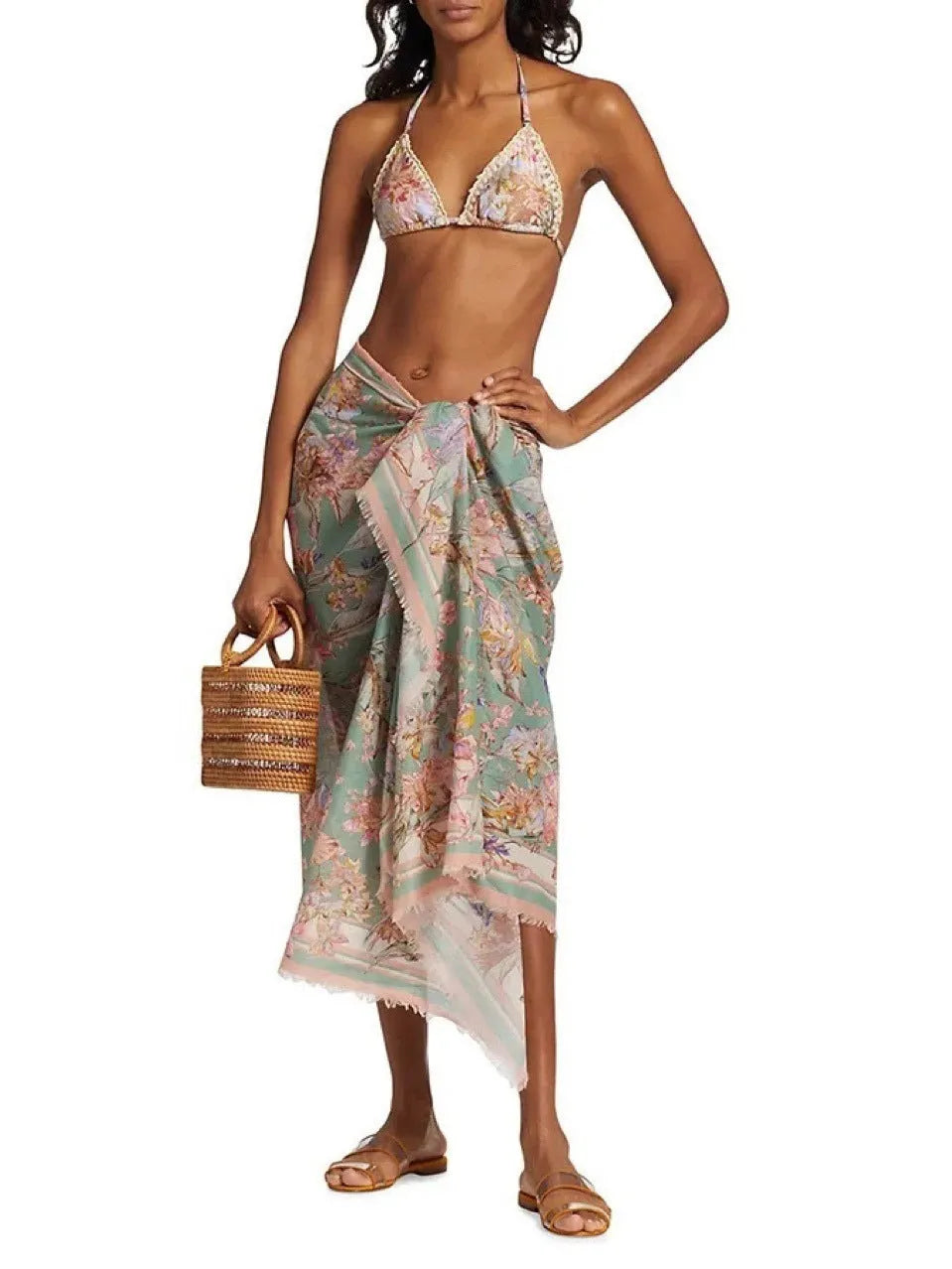 Women's creamy white floral bikini set with matching skirt for beach and swimming