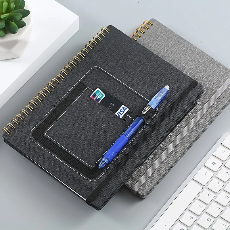 Erasable coil notebook with stone paper pages and customisable cover options including black, blue, and wood grain designs.