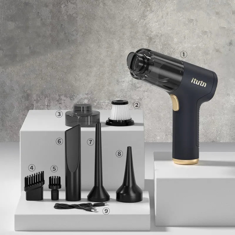 Black wireless car vacuum cleaner with multiple nozzle attachments including inflation nozzle and brush heads