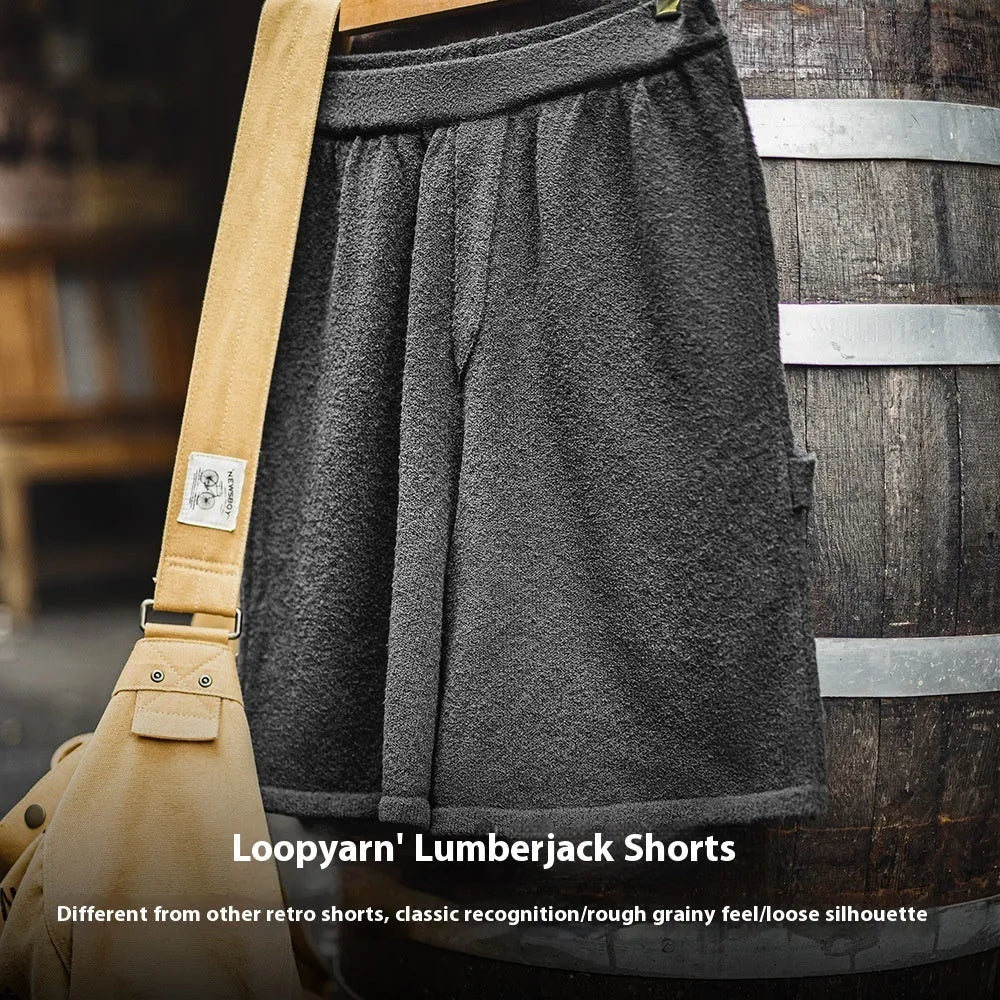 Cement grey polyester sports shorts with straight leg loose fit and elastic waistband