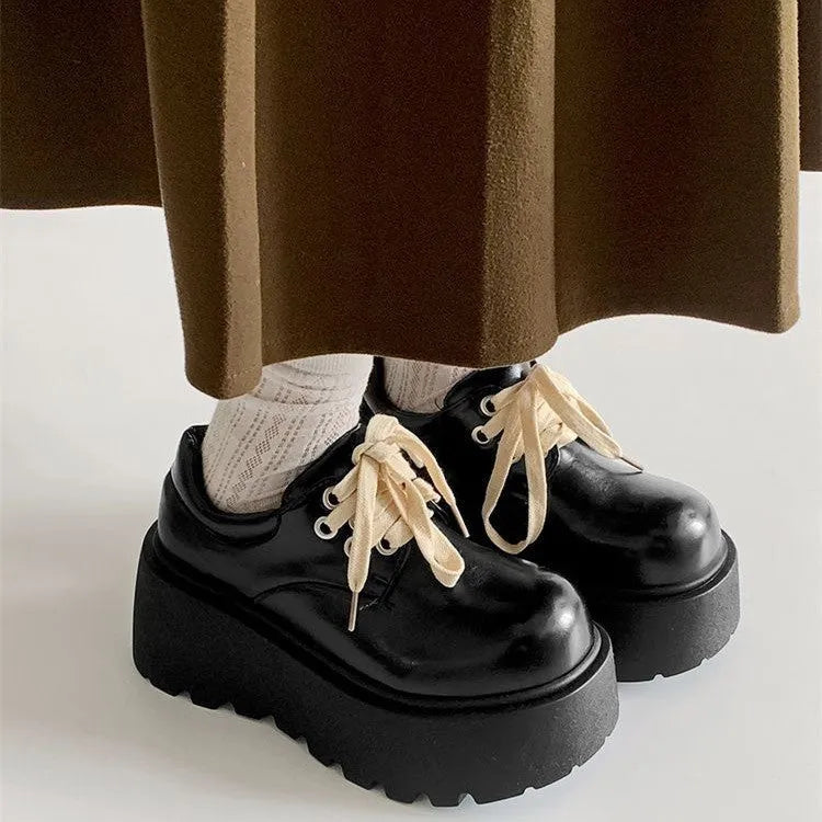 Matte black women's lace-up shoes with a chunky 6-8cm platform heel and round toe.