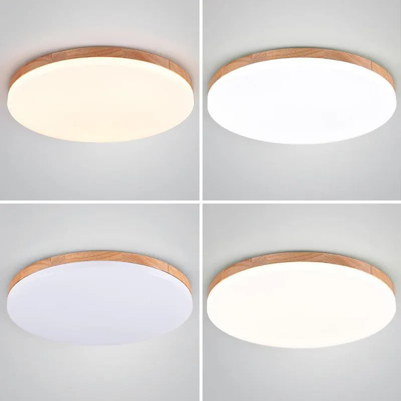 Japanese minimalist wood and acrylic LED ceiling lamp with a round acrylic shade on a wood body.
