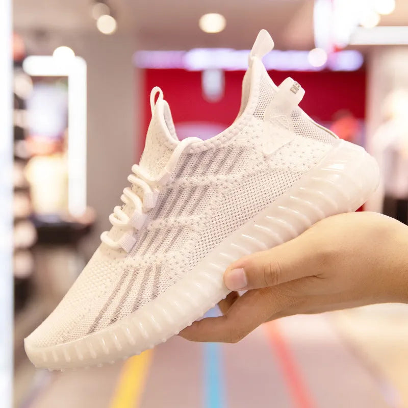 Men's white breathable fabric sports shoes with platform heel and round toe on a plain background.