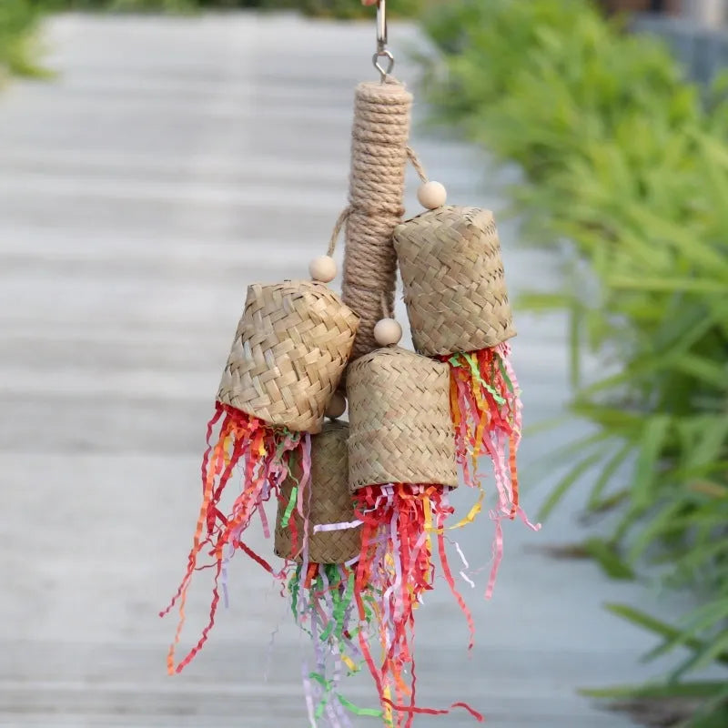 Colourful shredded paper and wood parrot hanging toy with sisal rope for medium birds.