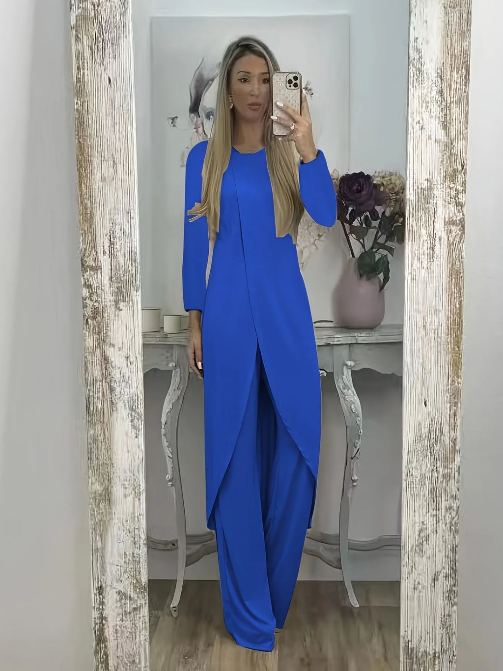 Black casual polyester two-piece tracksuit with long sleeves and trousers on a hanger
