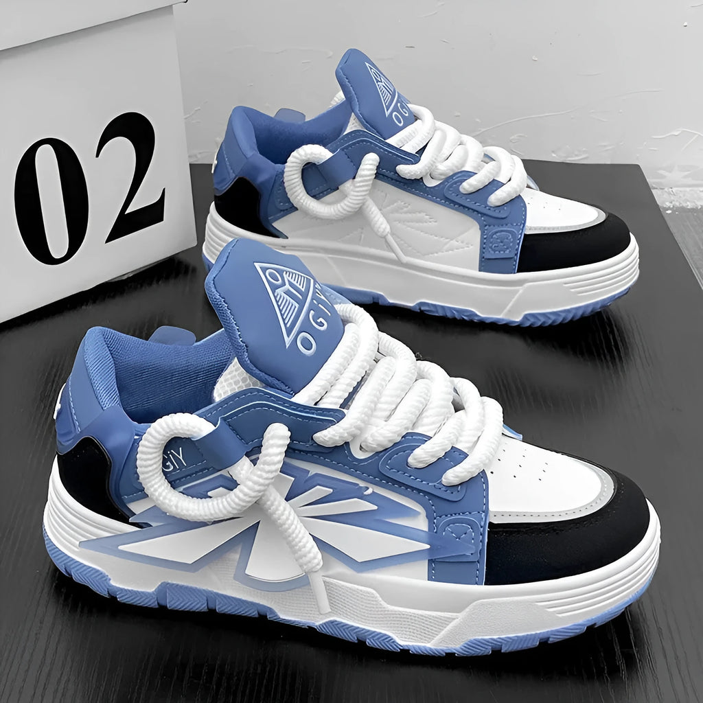 Men's white chunky sneakers with thick rubber sole, cartoon totem patterns, and lace-up front.