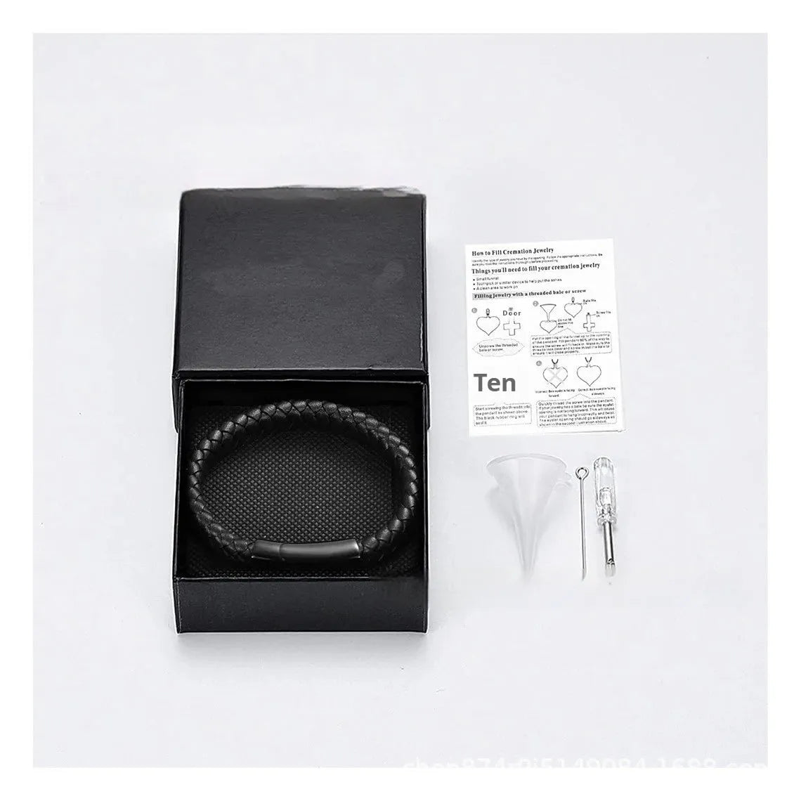 Black woven leather and stainless steel cinerary bracelet with engraving option on a gift box.