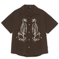 Brown striped short sleeve outdoor shirt with Cuban collar on a mannequin.