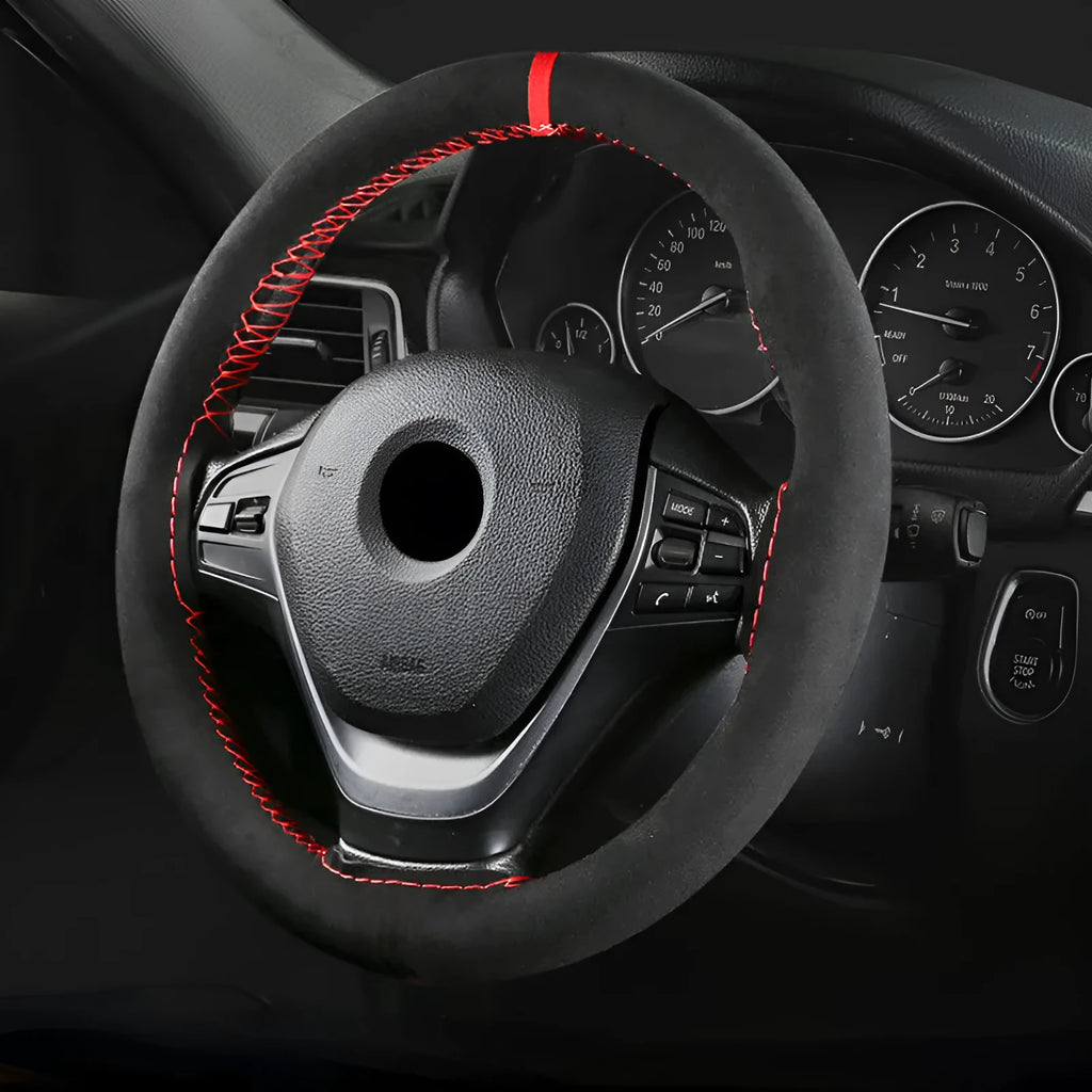 Black microfiber steering wheel cover with contrasting red stitch on 38cm diameter wheel