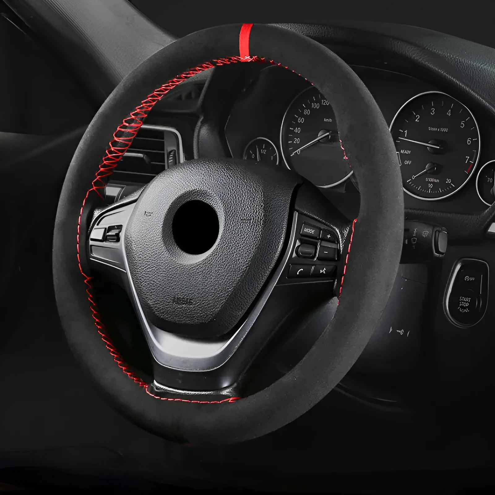 Black microfiber steering wheel cover with contrasting red stitch on 38cm diameter wheel