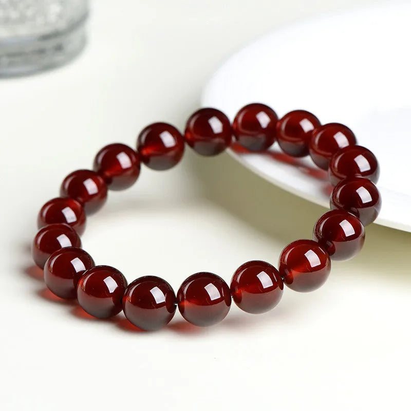 Natural orange red garnet crystal bracelet with Ruyi design elements in retro style