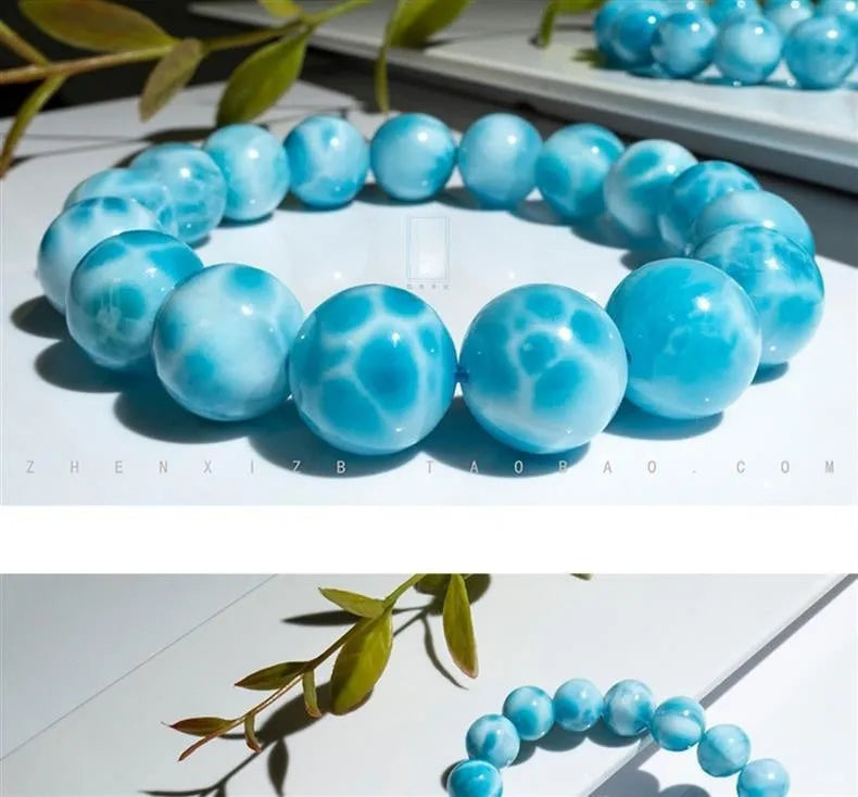 Blue handmade Bodhi bead bracelet with crystal sea-pattern stone and pearl accent on wrist