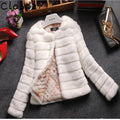 Women's short sleeve faux fur top in beige colour on a hanger
