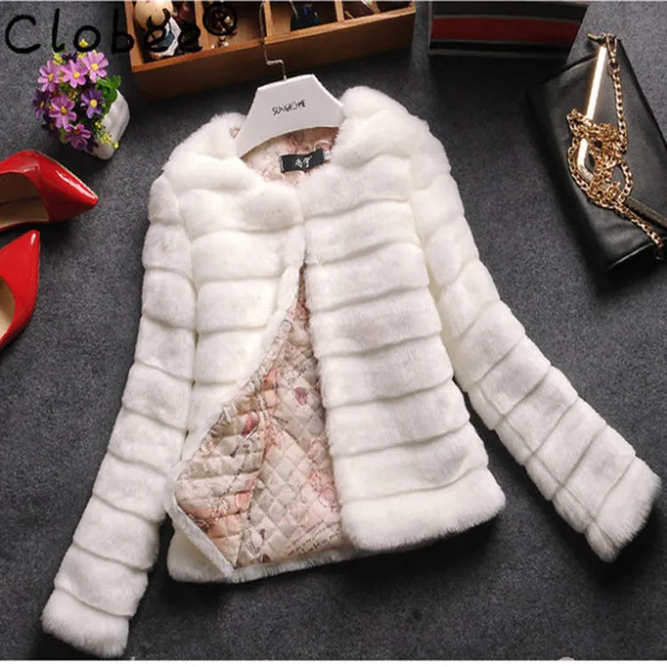 Women's short sleeve faux fur top in beige colour on a hanger