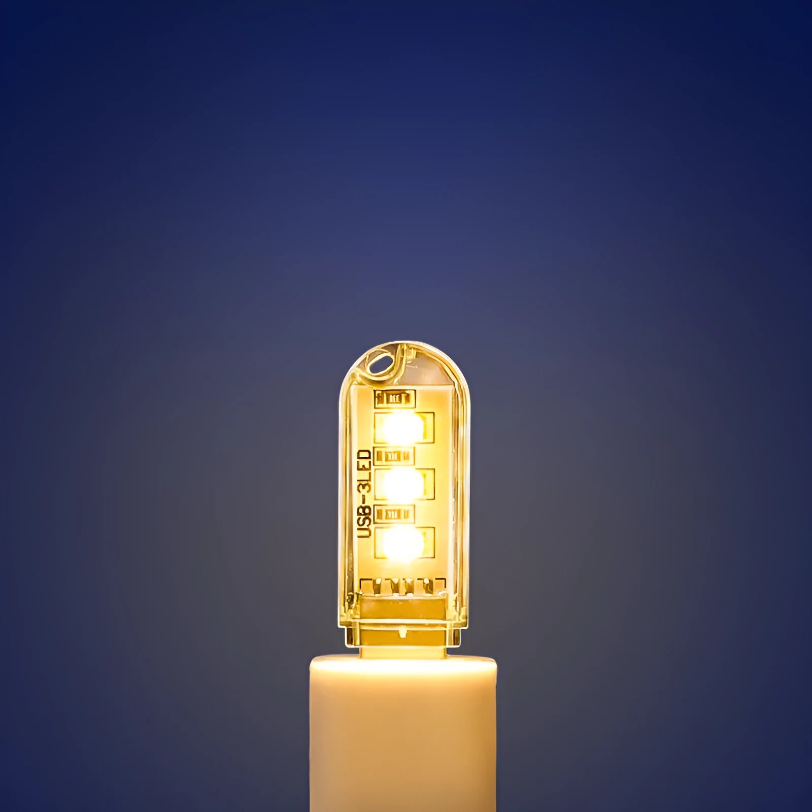 Compact white USB-powered LED baby night light with choice of warm or white light colour.