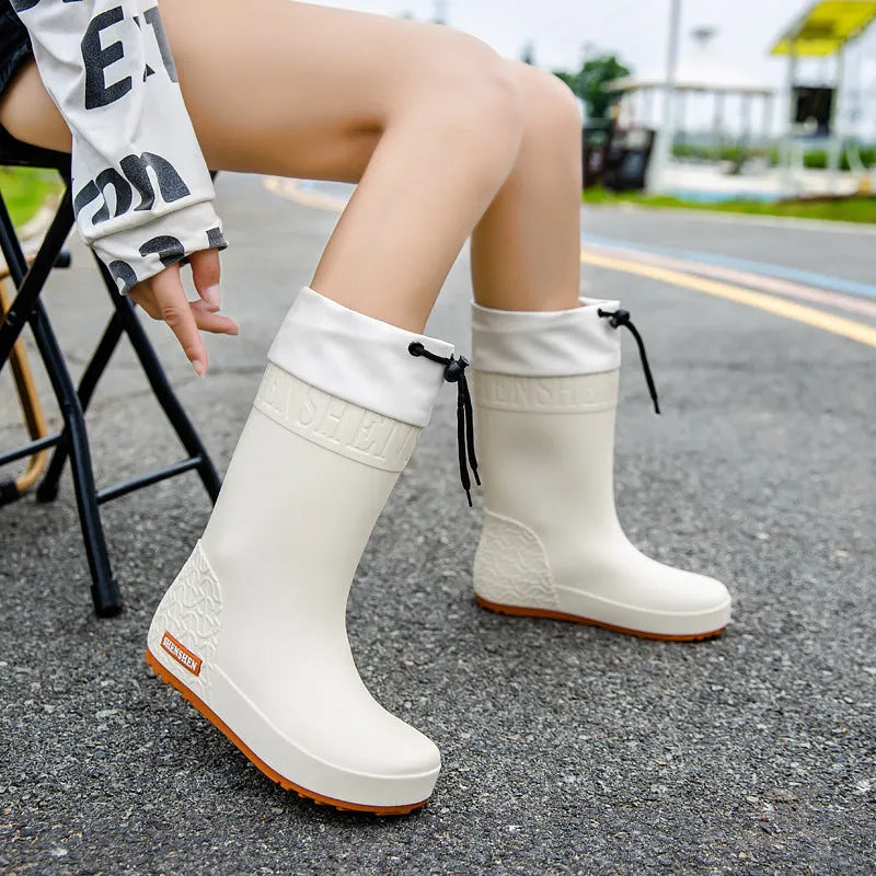 Women's non-slip PVC rain boots in apricot colour showing waterproof wellington boot design
