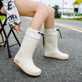 Women's non-slip PVC rain boots in apricot colour showing waterproof wellington boot design