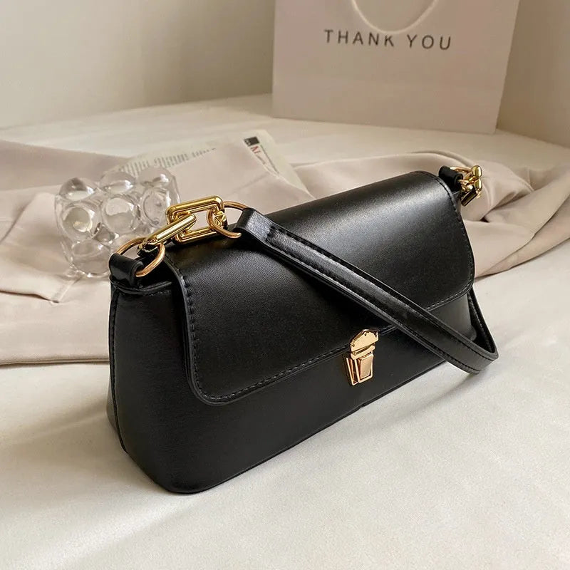 Brown French casual underarm bag with single shoulder chain, showing horizontal square shape and sandwich pocket design