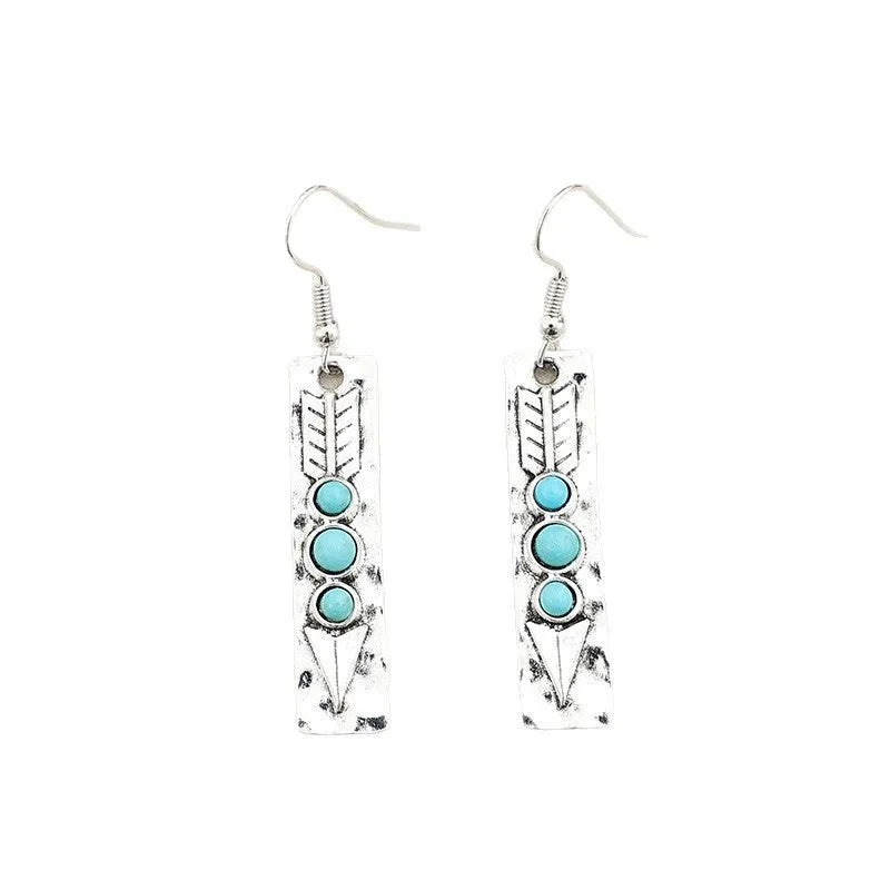 Long geometric silver earrings with turquoise stone accents and retro design