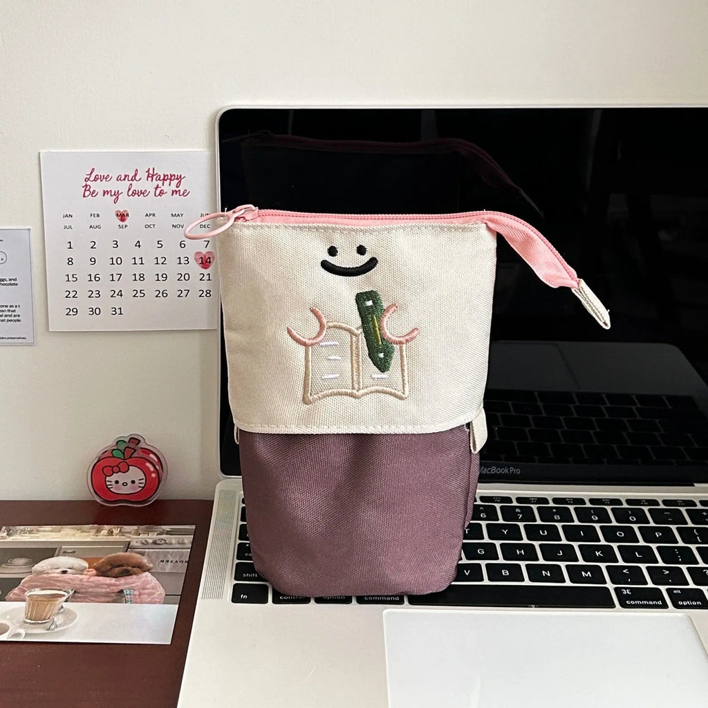 Brown collapsible Korean style cartoon print pencil case made from Oxford fabric.