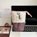 Brown collapsible Korean style cartoon print pencil case made from Oxford fabric.