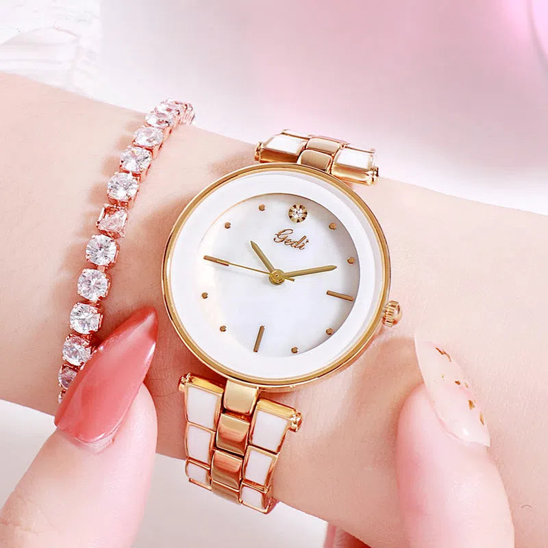 Ladies quartz watch with white dial, rose gold tone, 30mm round alloy case, and steel strap