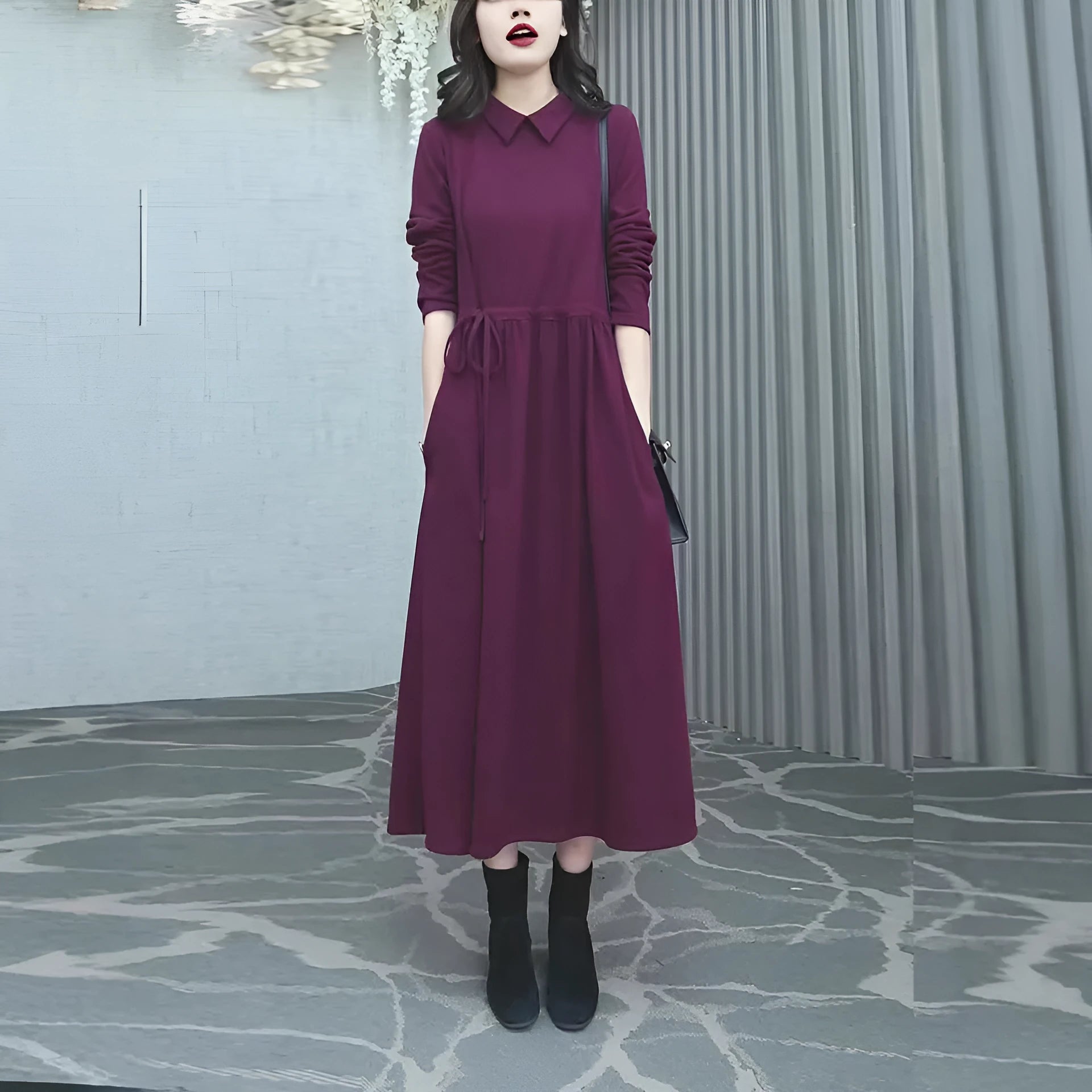 A purplish red plus size long sleeve dress for women, featuring a long skirt and urban commute style.
