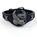 Black leather geometric bracelet with an alloy eagle clasp on a wrist.