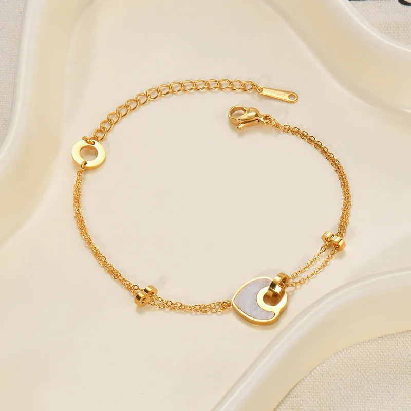 Stainless steel and resin heart-shaped bracelet for women with double layer design.