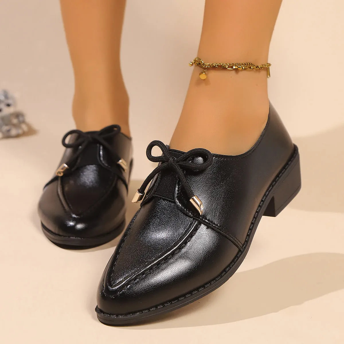 Women's British-style leather shoes with decorative bow details and rubber sole