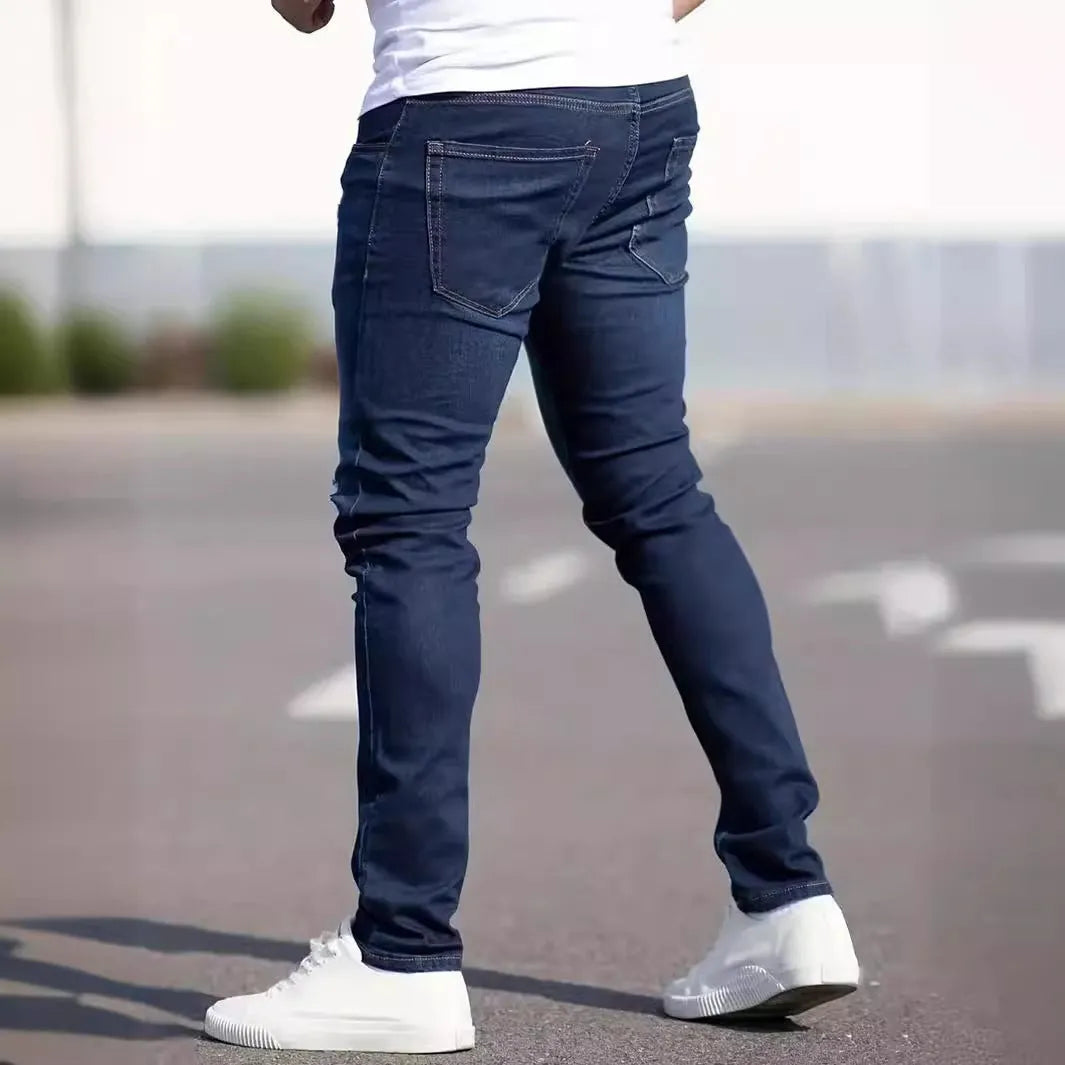 Men's dark blue slim fit jeans with skinny leg design and street fashion style