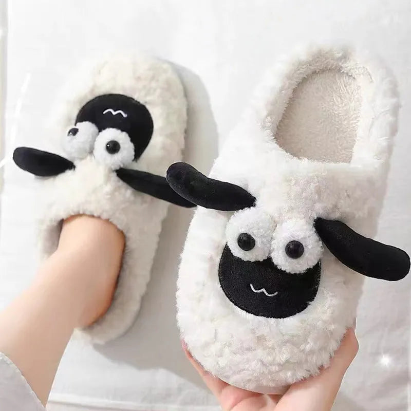 Brown, grey, and white suede slip-on slippers with a PVC sole on a plain background.