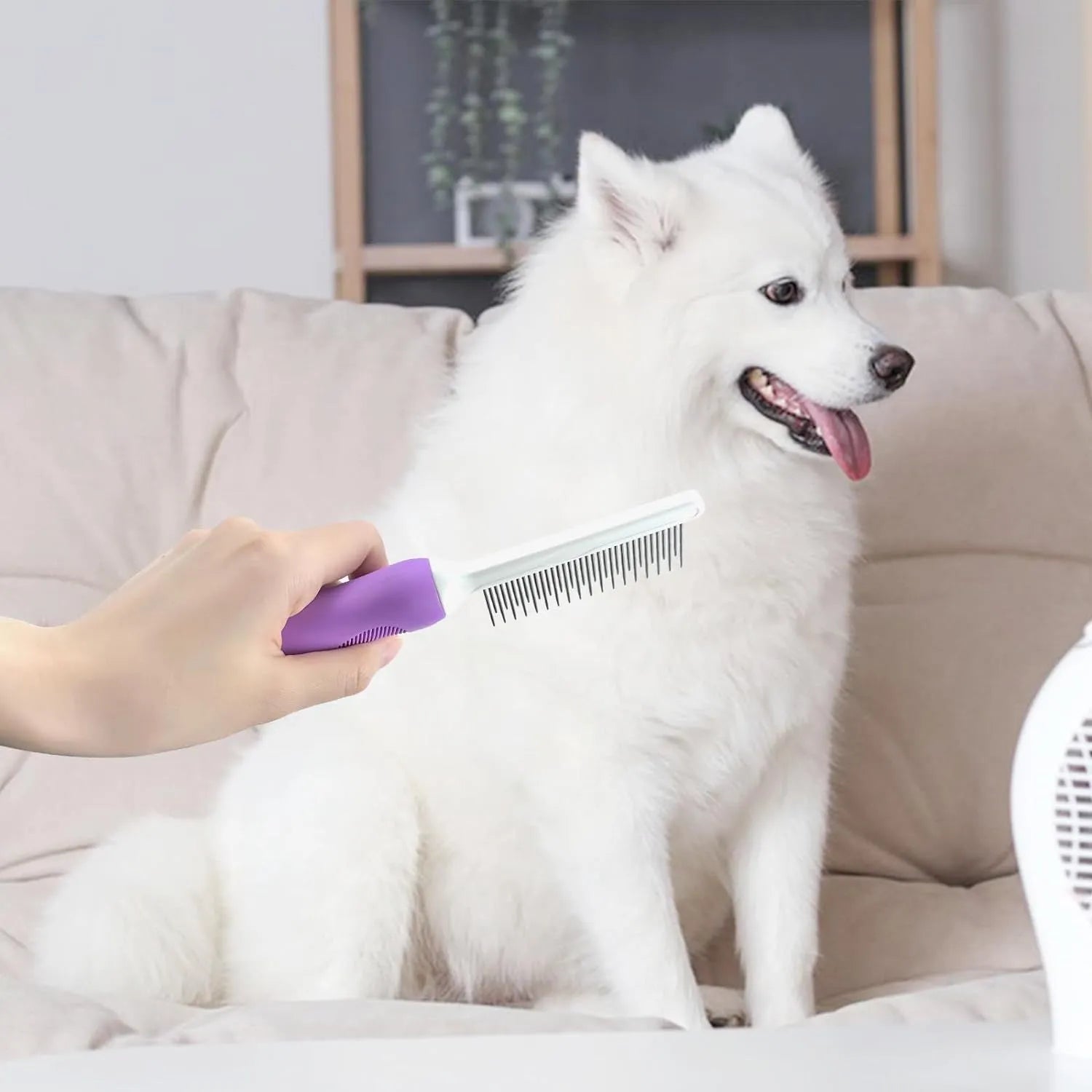 Purple pet grooming comb with stainless steel long and short teeth on an ergonomic handle.
