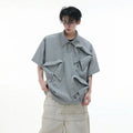Men's black polo shirt with a grey geometric Giant Land Turtle print and a deconstructed shirt collar.