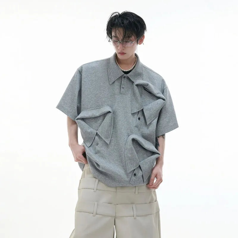 Men's black polo shirt with a grey geometric Giant Land Turtle print and a deconstructed shirt collar.