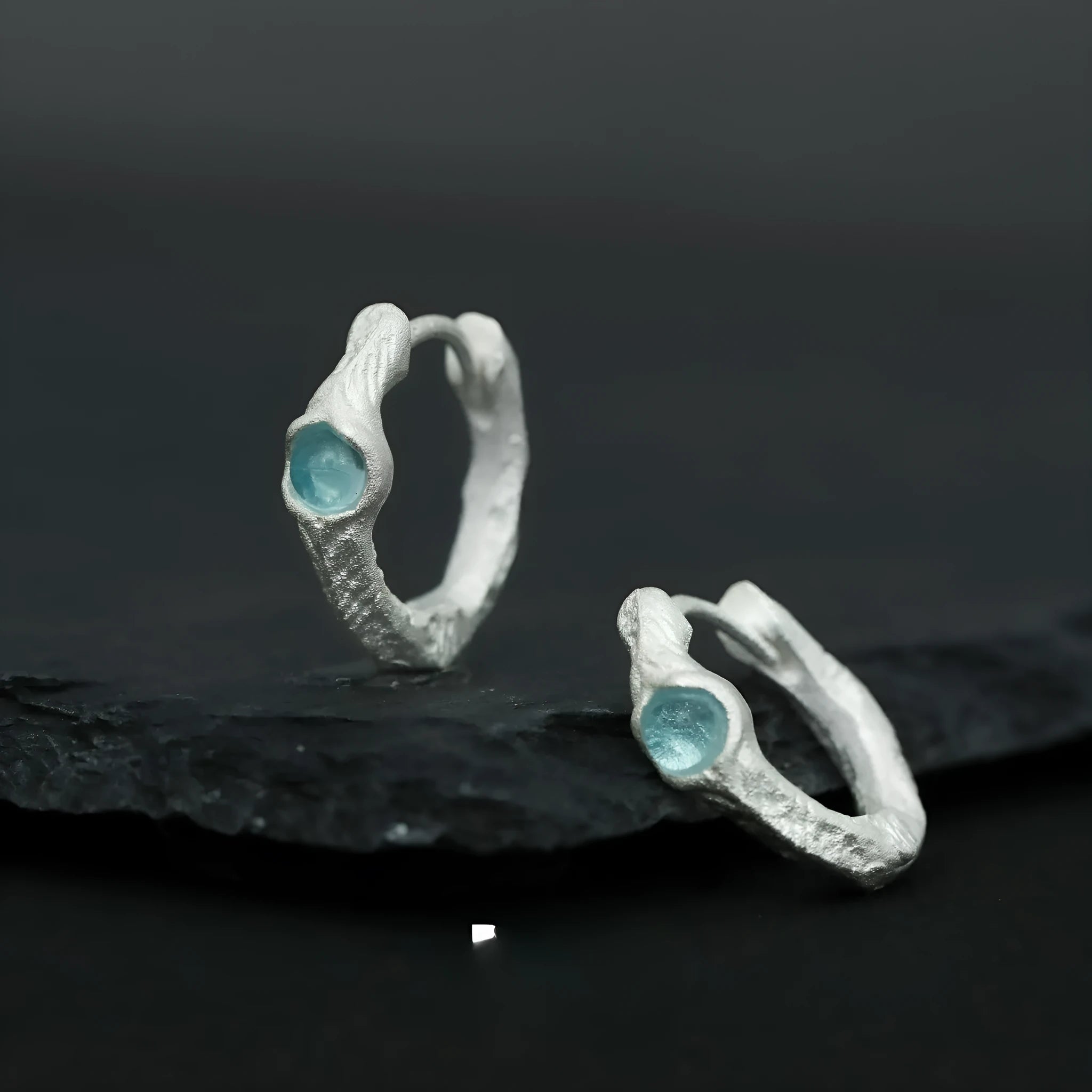 Burnt silver geometric circle ear clips for women made from 925 sterling silver.
