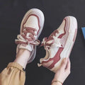 Women's pink and white low-top rubber sneakers with height increasing soles